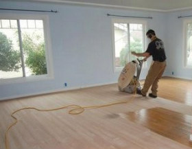 Man Sanding Wood Floors